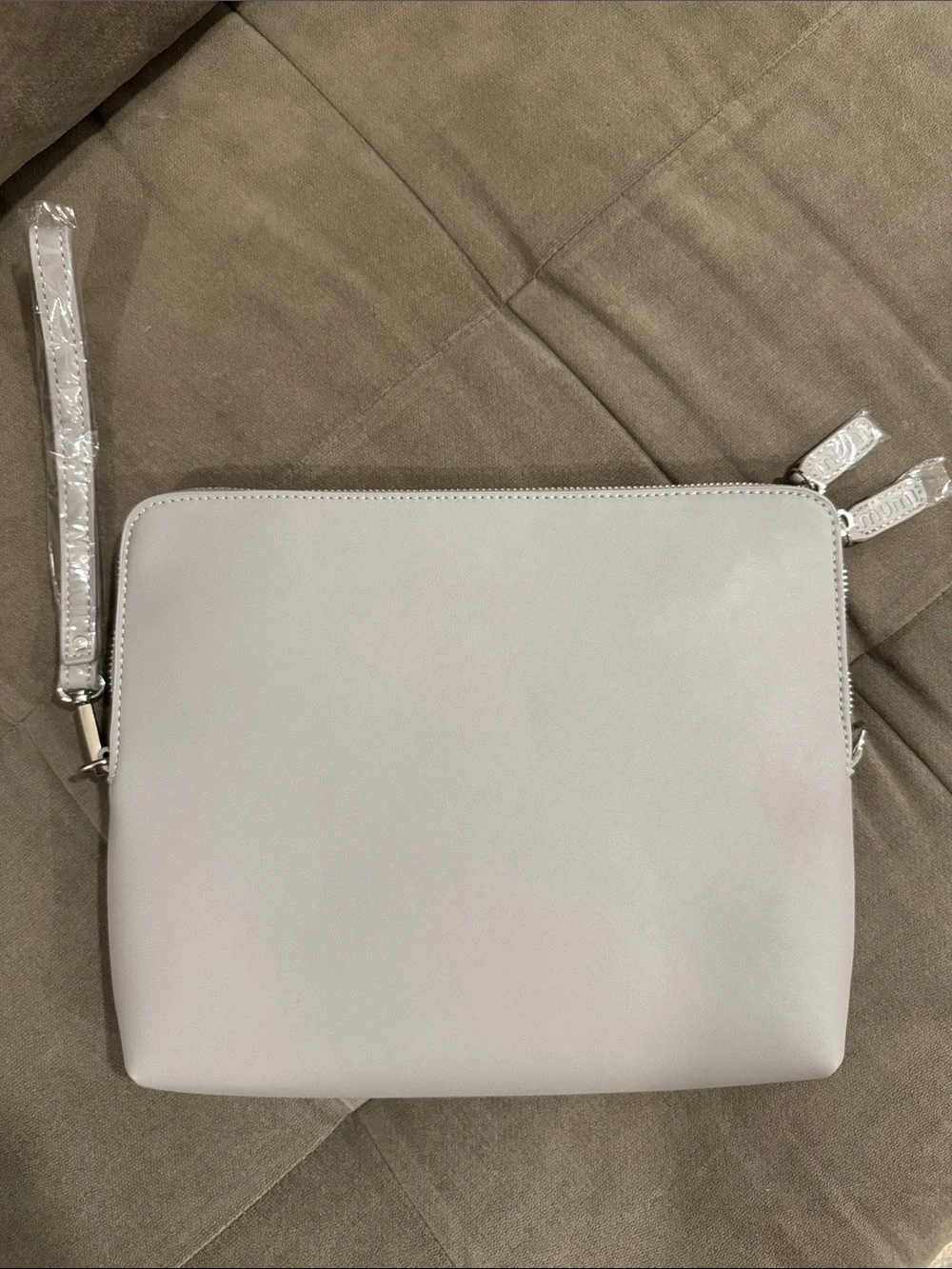 the mumi x NEAT Method collaboration Travel Clutch